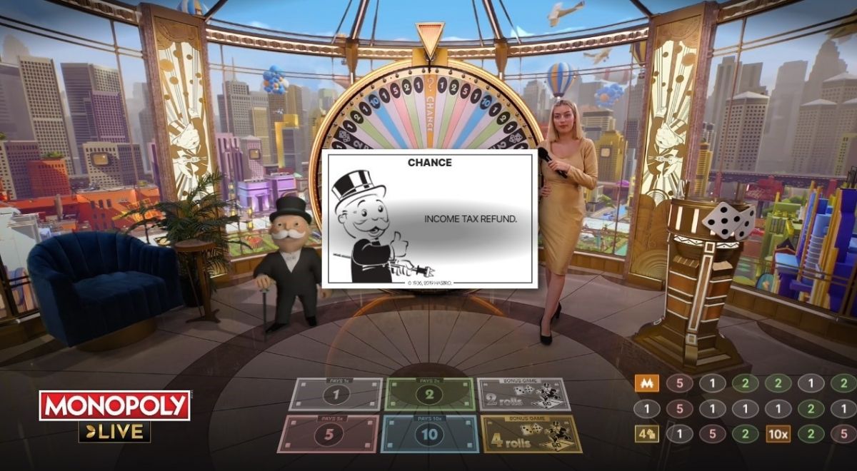 If the wheel lands on either of the two orange “Chance” segments, Mr. Monopoly will reveal a card with a random prize or a multiplier bonus.