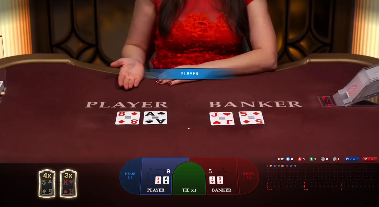 As players eagerly look on through their screens, the smiling dealer confidently announces the winning hand after the last cards are revealed to the baccarat table.
